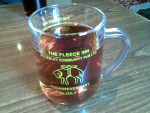 Glass tankard commemorating the second anniversary of The Fleece Inn as a community-run pub